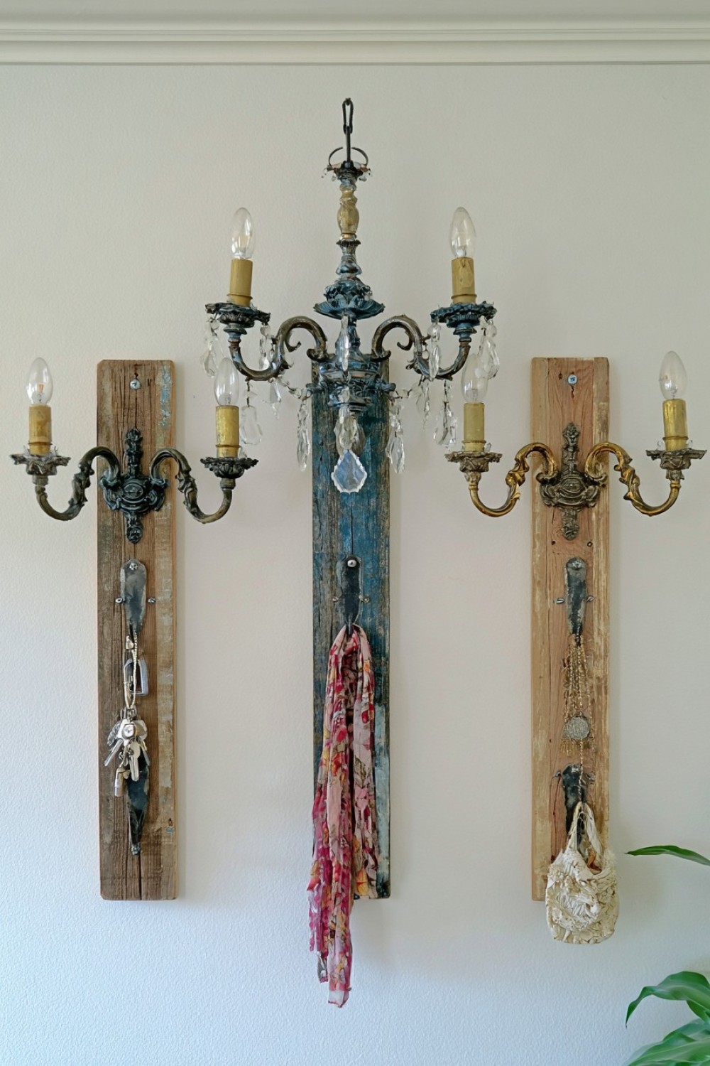 14. Turn Chandelier Arms Into Wall Hooks