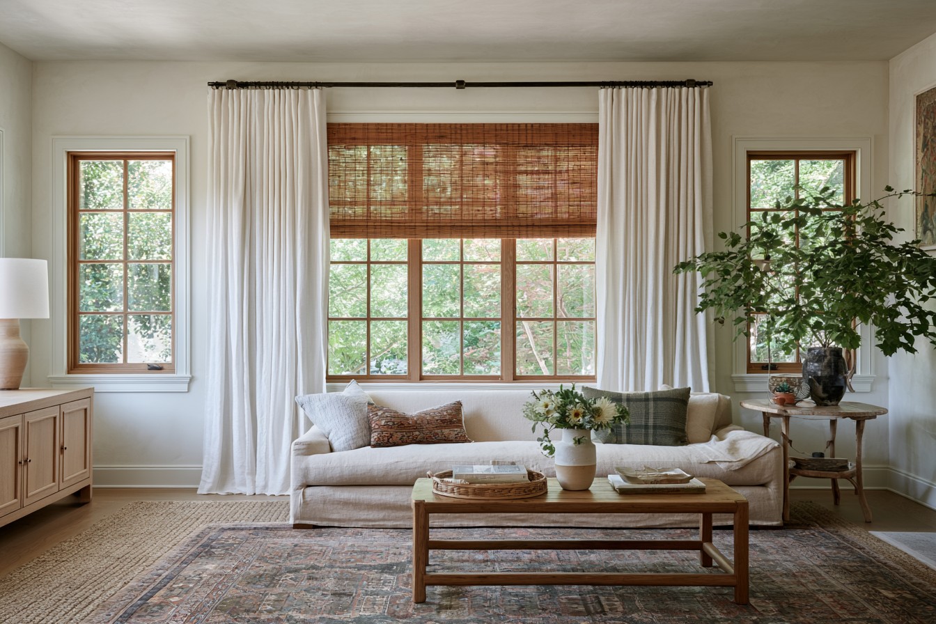 Wooden blinds and natural timber details warming a neutral room