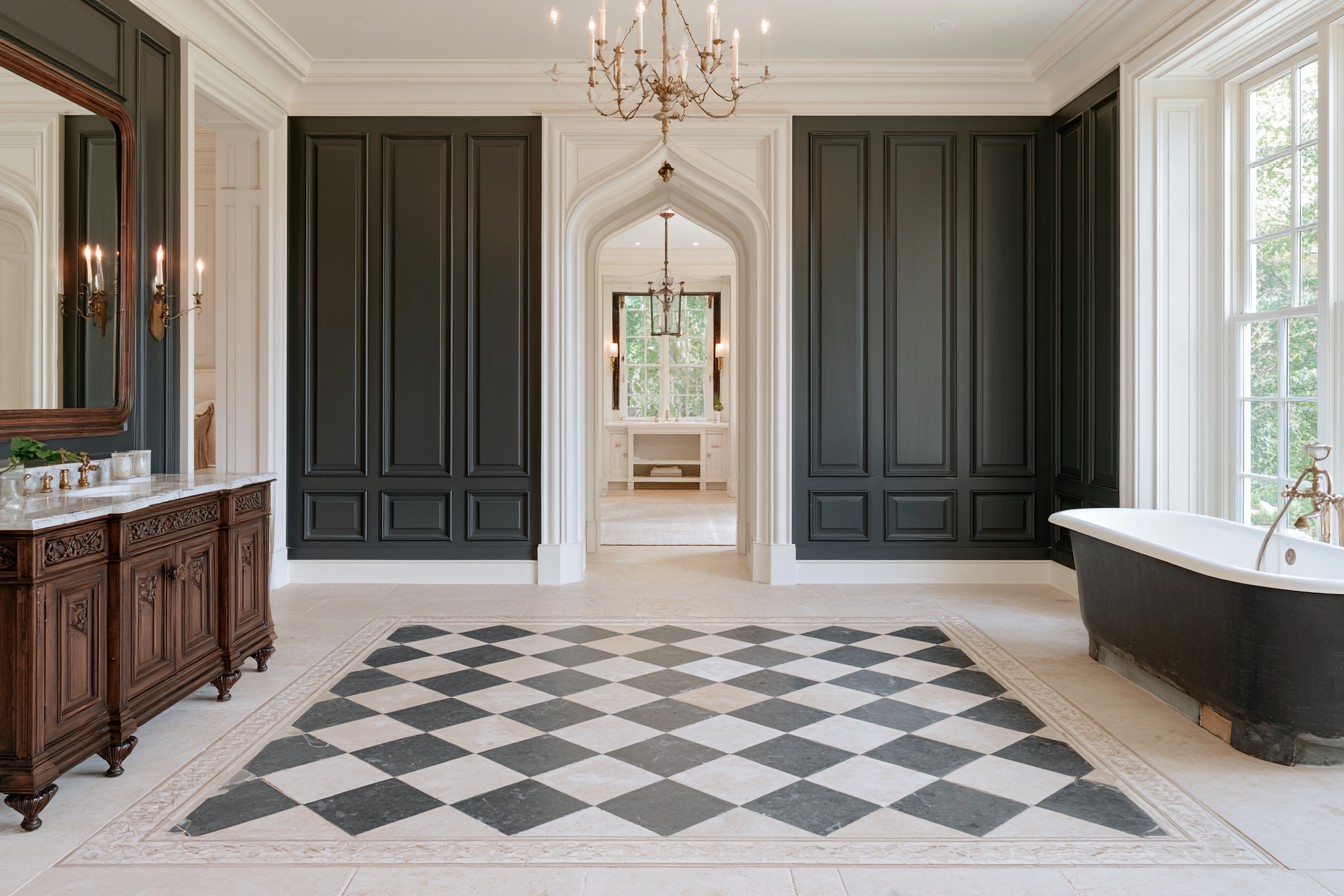 Checkerboard stone bathroom floor finished with a Gothic border