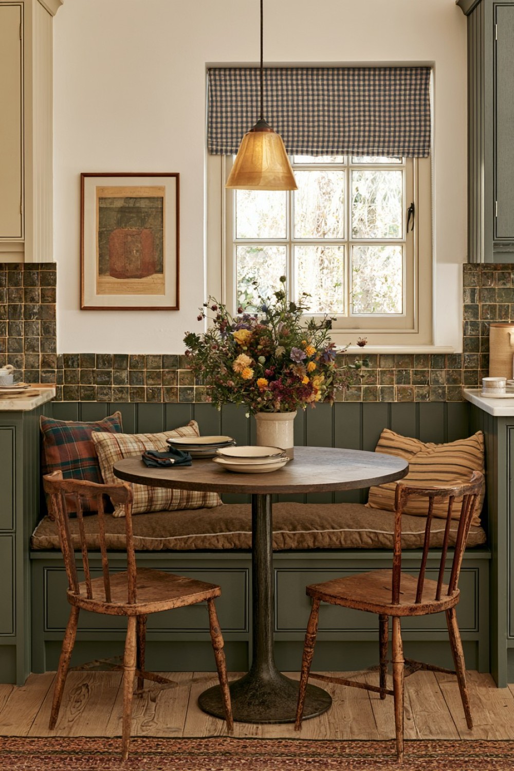 Built-in breakfast bench in a compact cottage kitchen corner