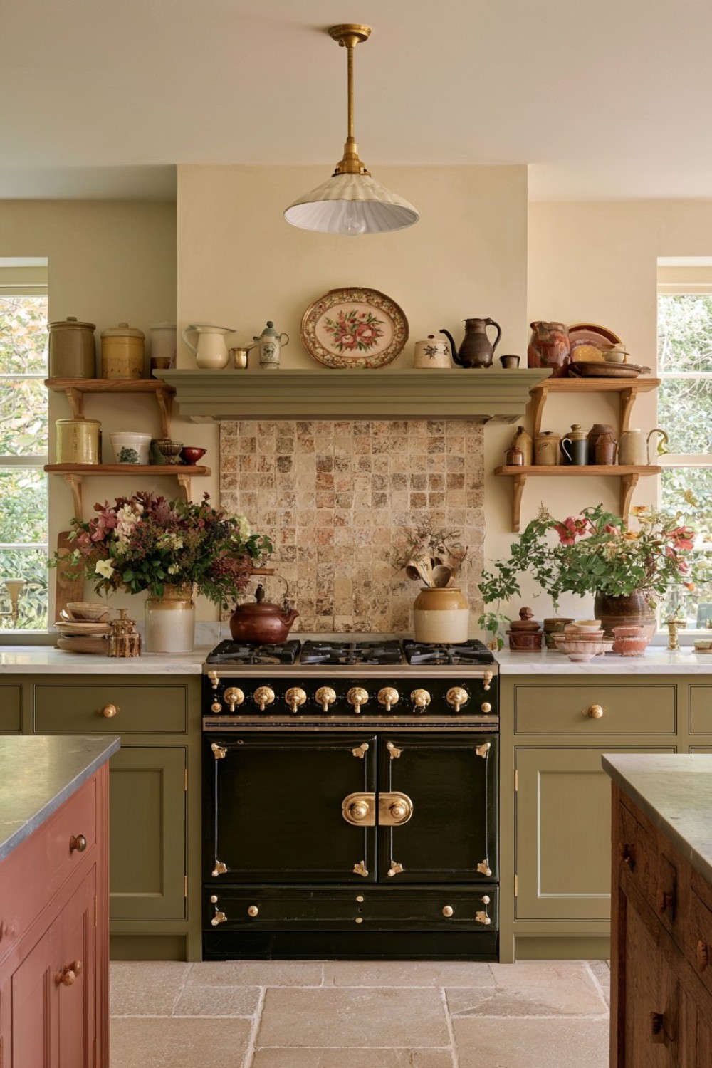 Simple open shelves framing a cottage kitchen cooking range