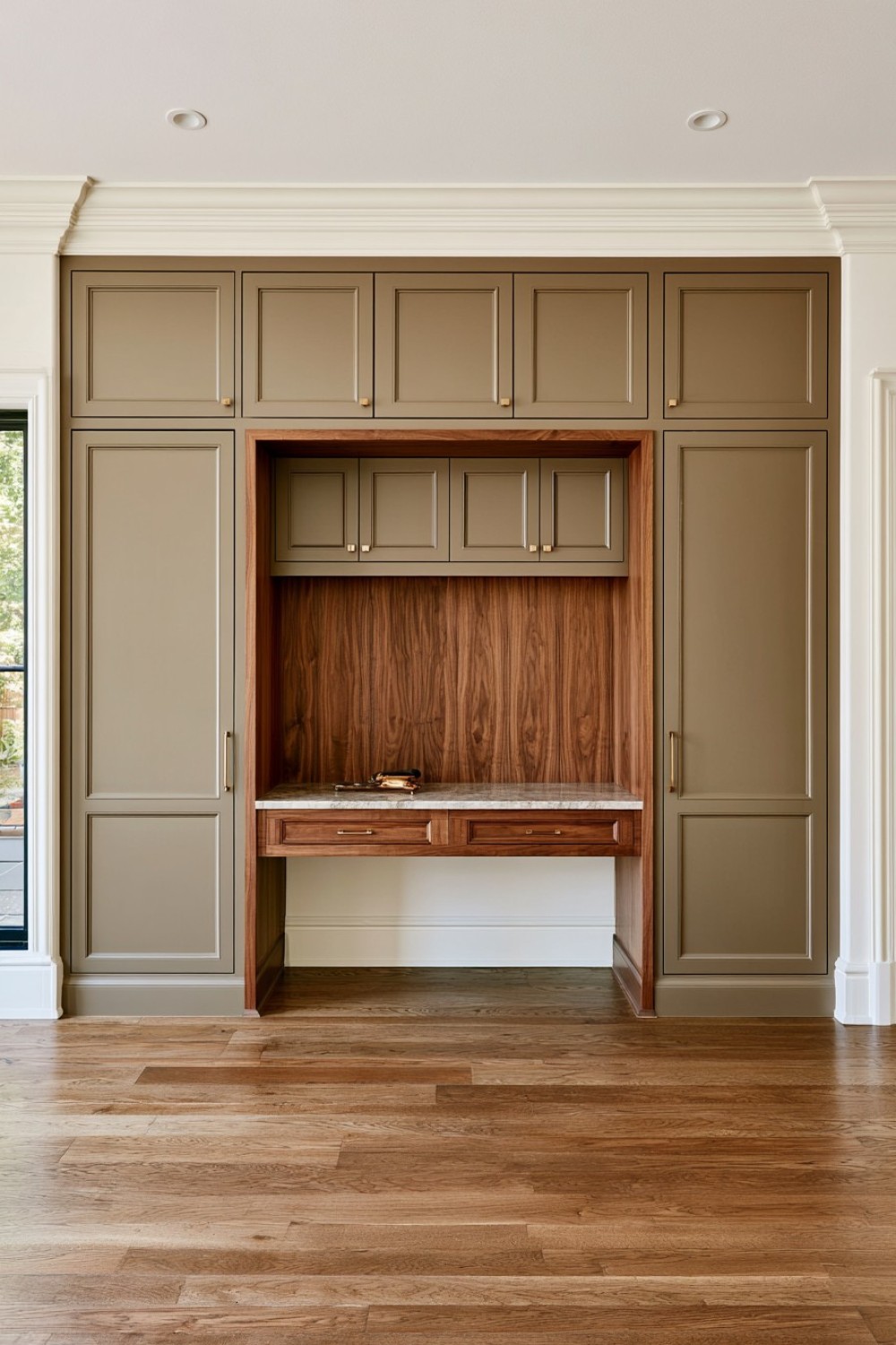 Full-height kitchen cabinet wall with an integrated workstation