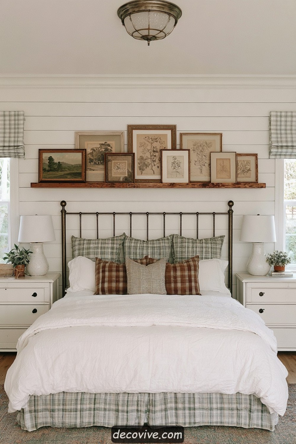Long picture ledge framing a farmhouse bedroom headboard wall