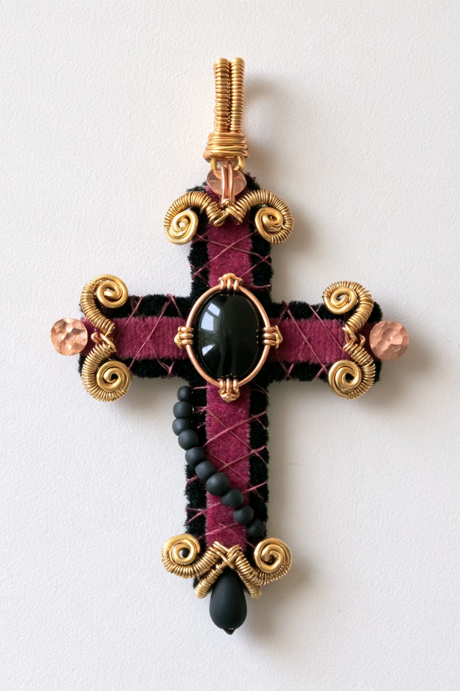 Burgundy textile cross with sculptural gold wire scrolls