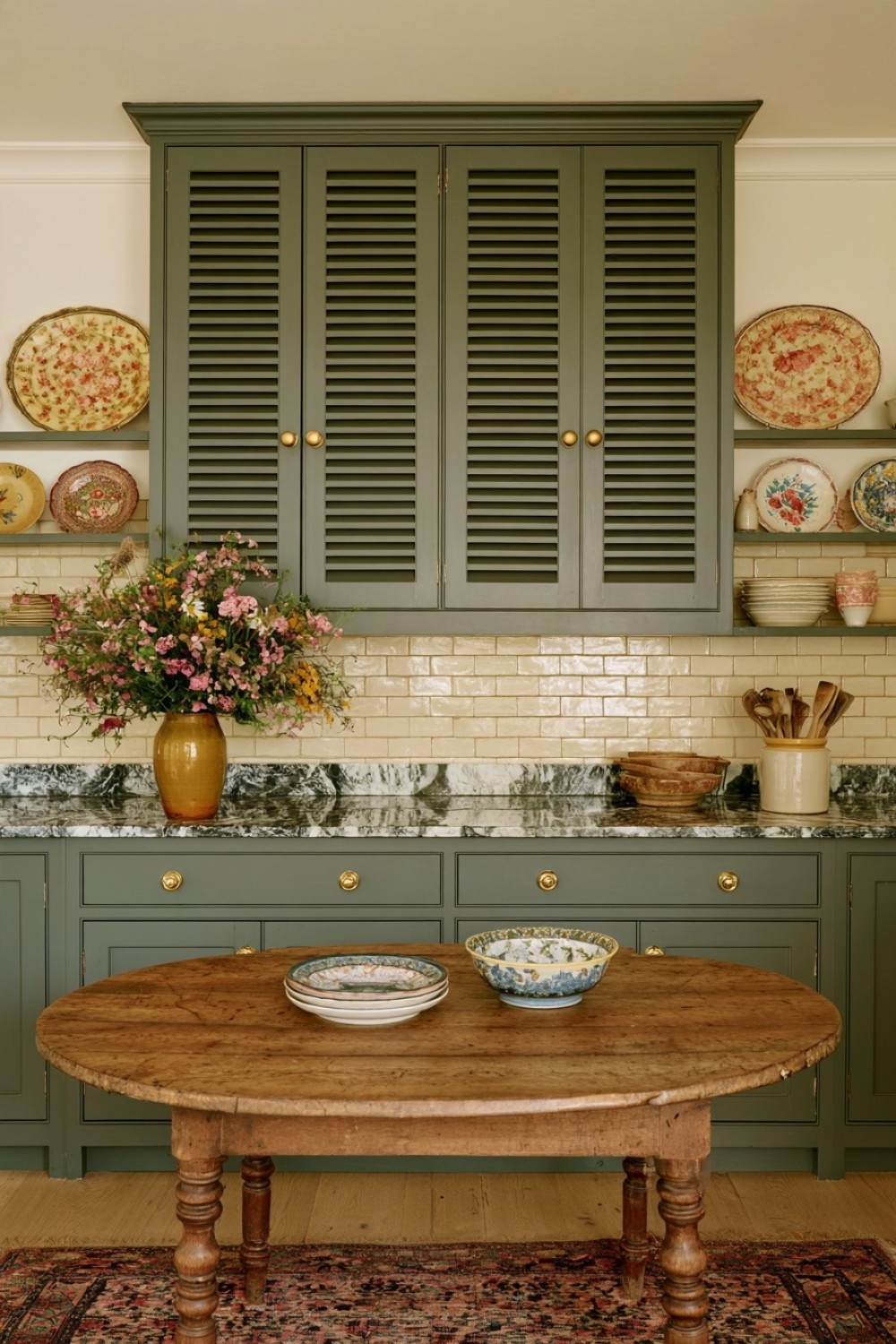 Paneled pantry doors adding traditional cottage kitchen character