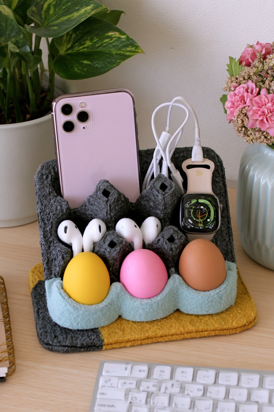 Desk charging station organizer made from reinforced egg carton compartments