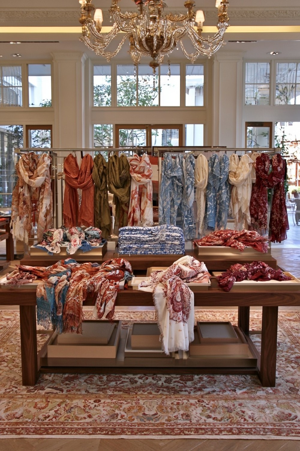 Central boutique scarf display island with layered levels