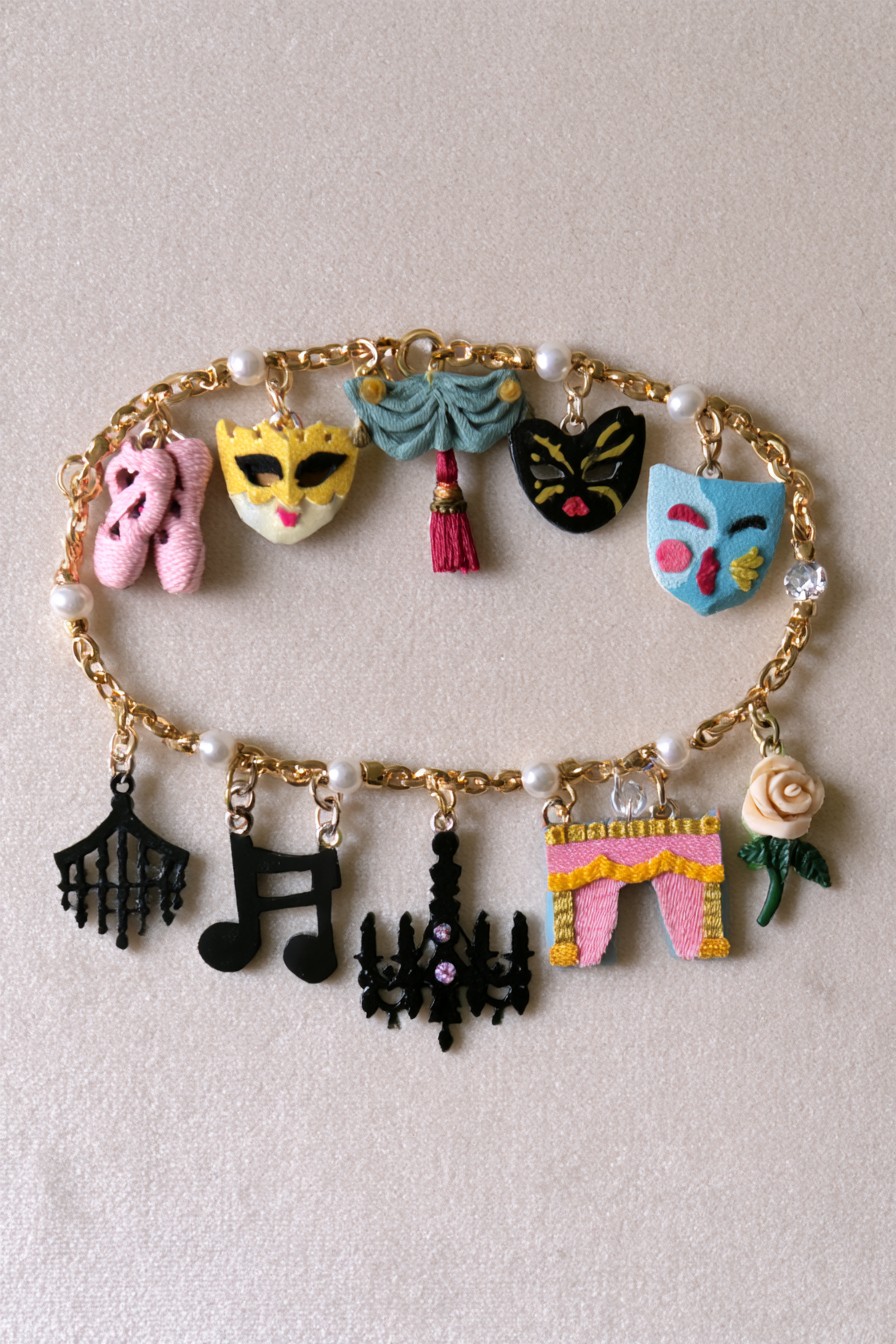 Ballet and theatre charm bracelet with slippers masks stage curtains music notes and rose