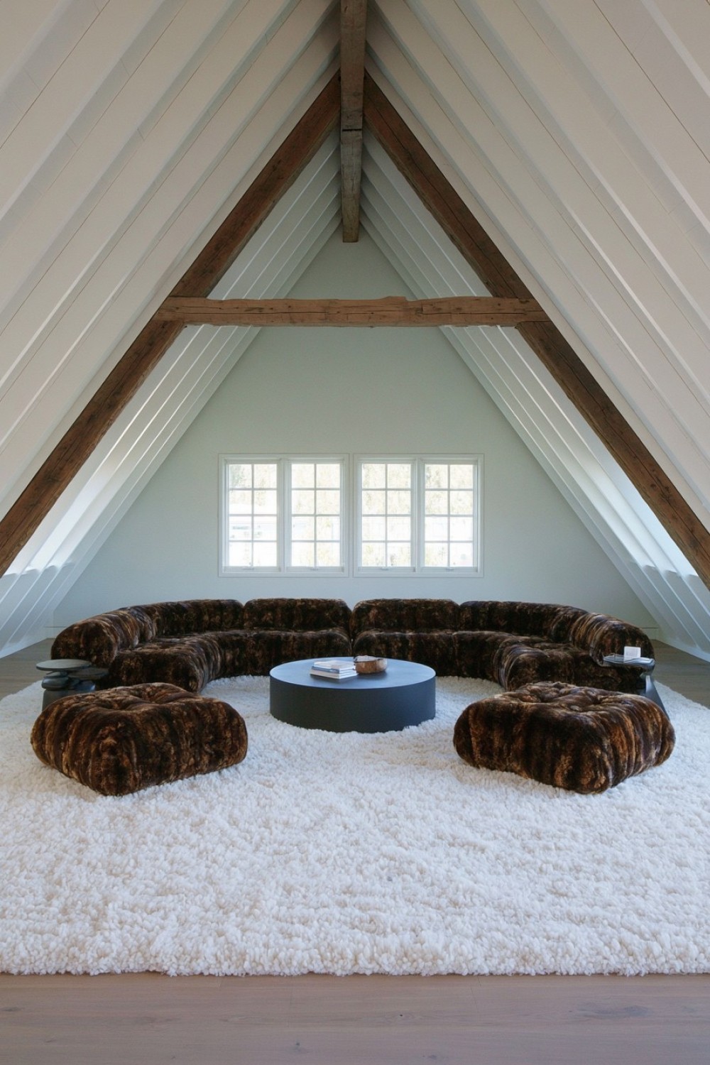 Conversation-pit-inspired social seating in an attic