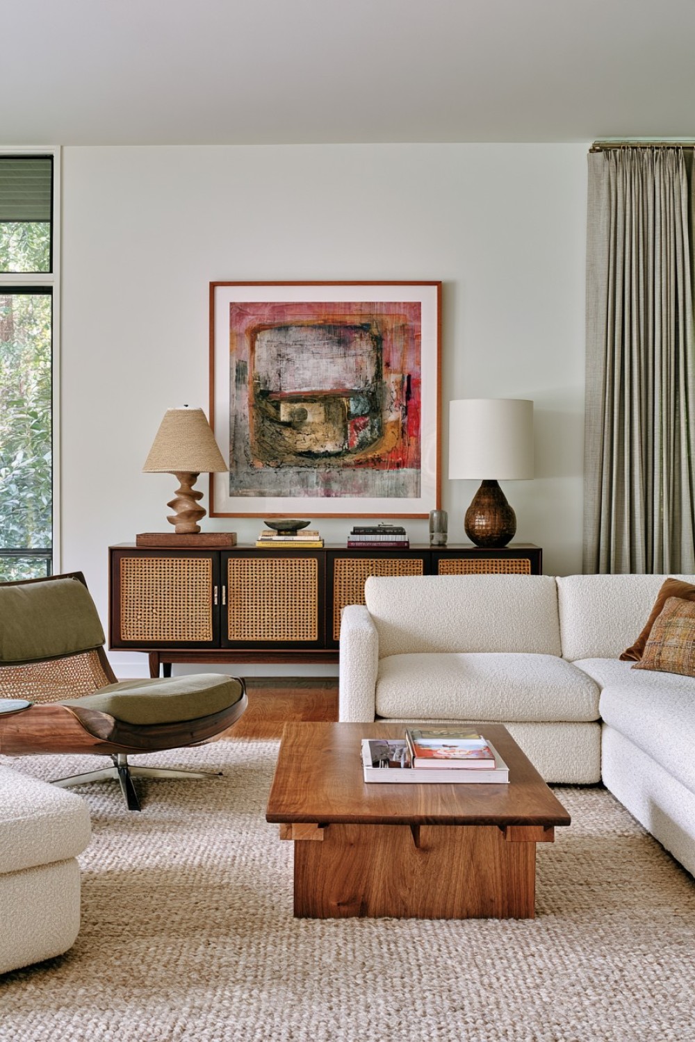 Cane and walnut furniture in a warm mid-century living room