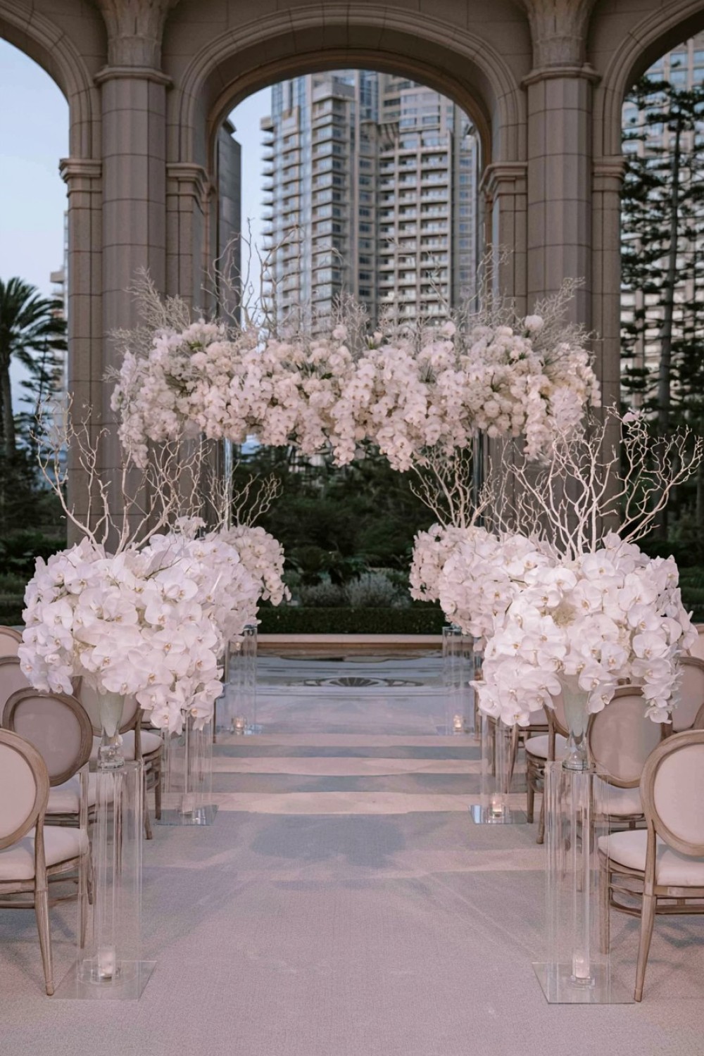 3. Transparent Pedestals Framing The Aisle