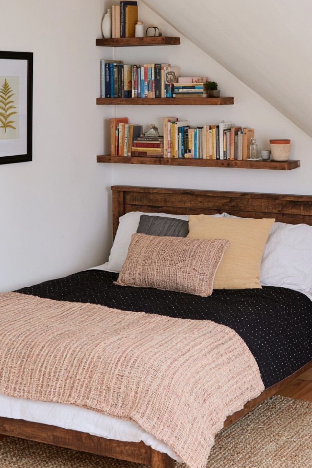 Monochrome attic bedroom layered with black gray and white textures
