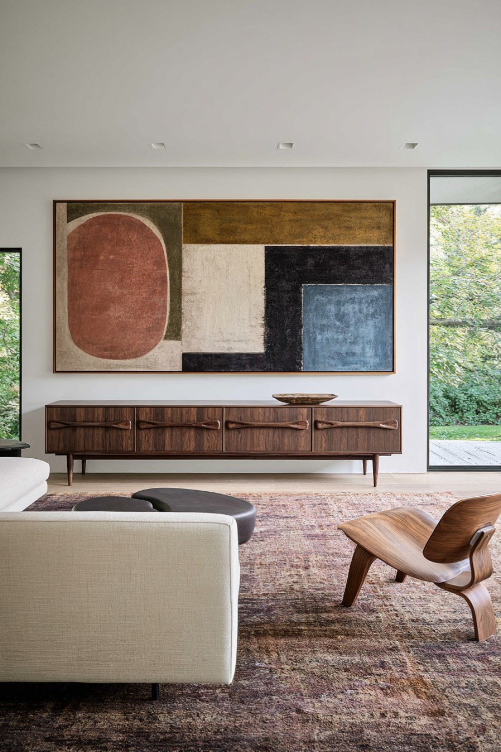 Mid-century living room organized around oversized abstract artwork