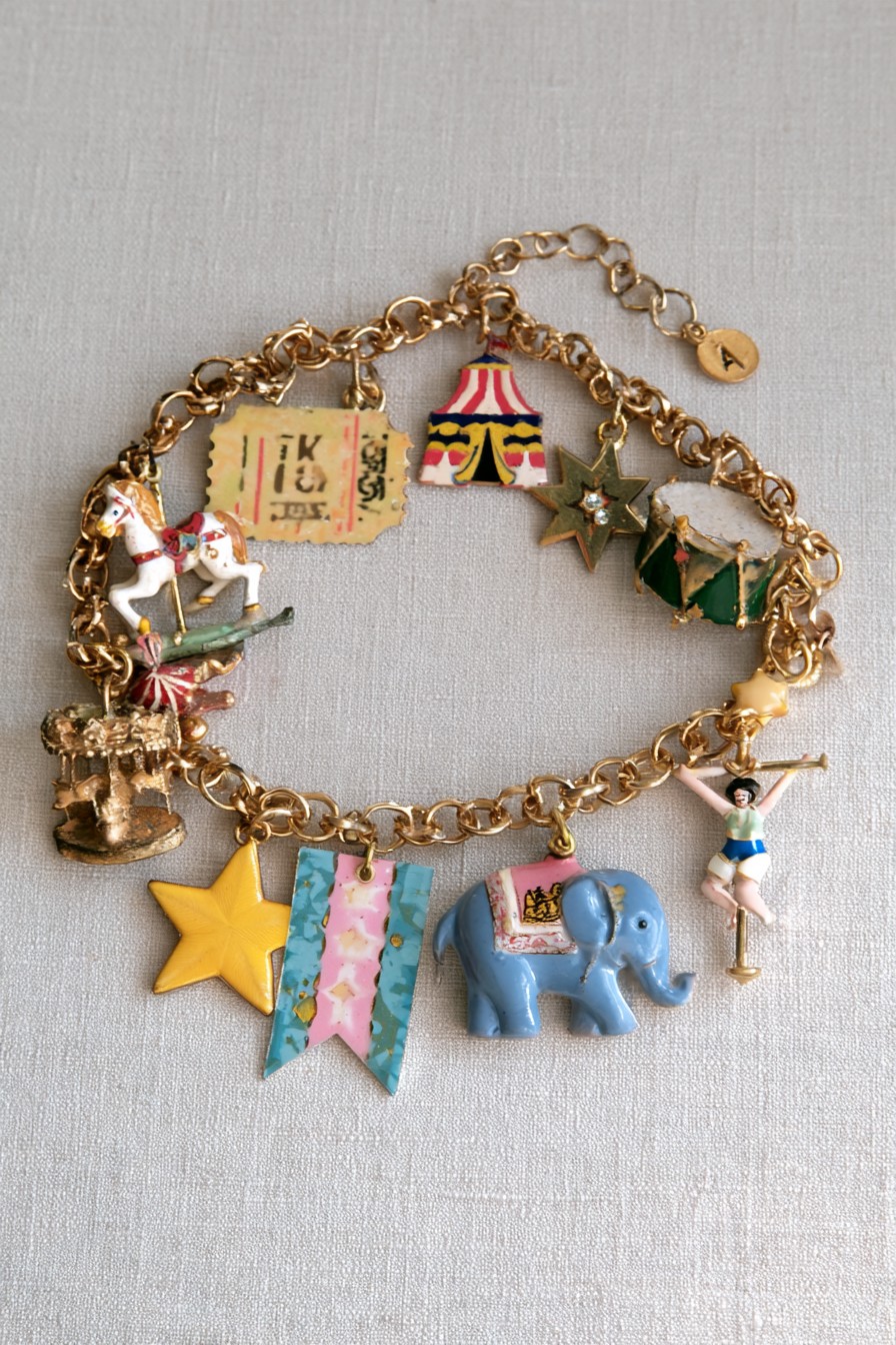 Vintage circus bracelet with carousel horse tent drum elephant acrobat stars and banners