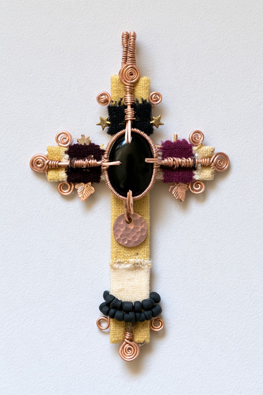 Mixed-media cross with fabric, copper wire, and black stone
