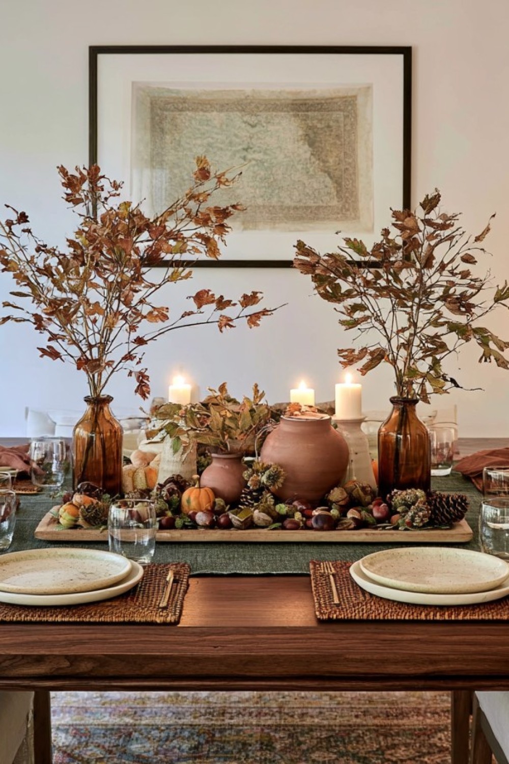 Autumn table decorated with prepared leaves branches and earthy colors