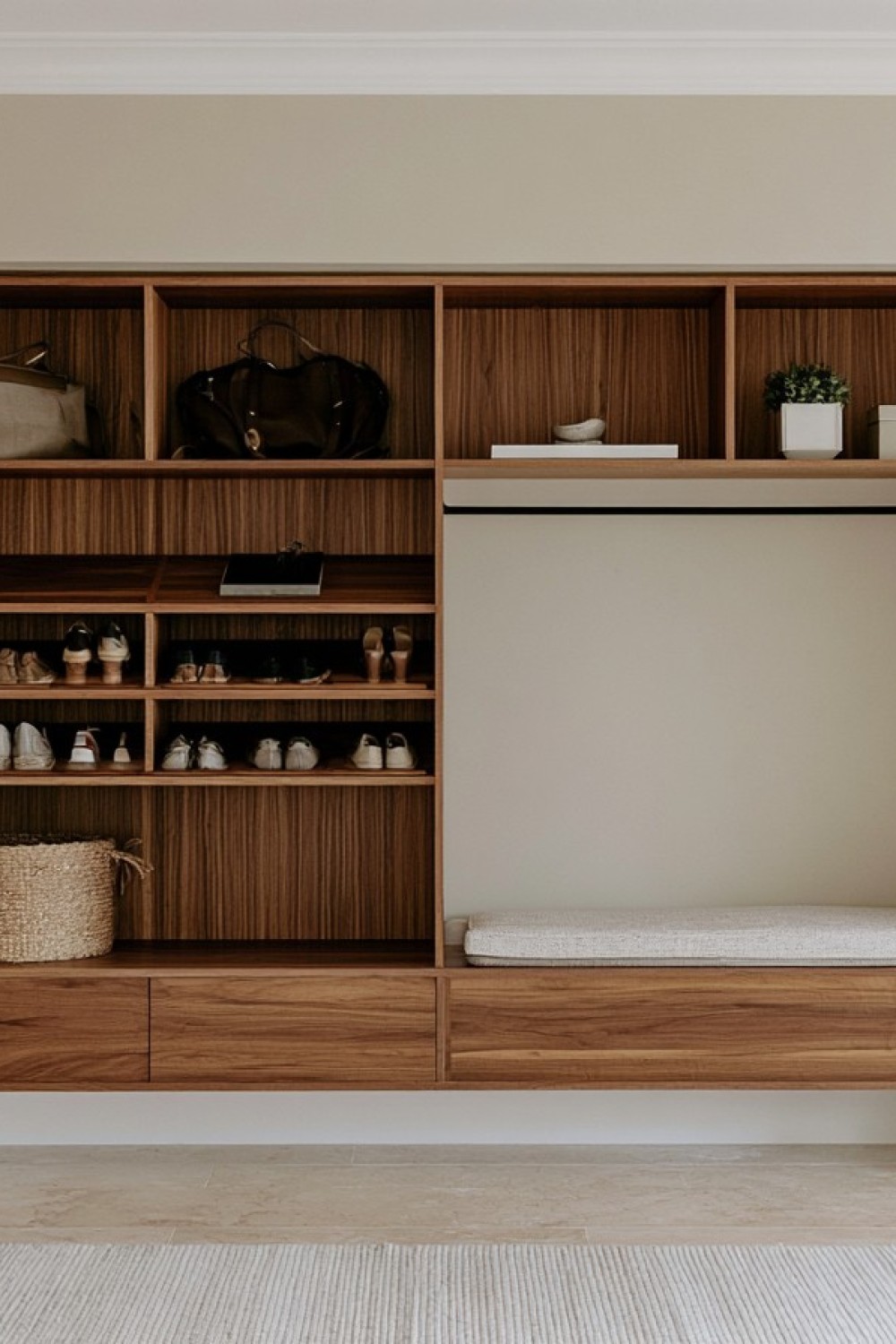 Slim entryway cabinet organizing shoes bags and everyday accessories