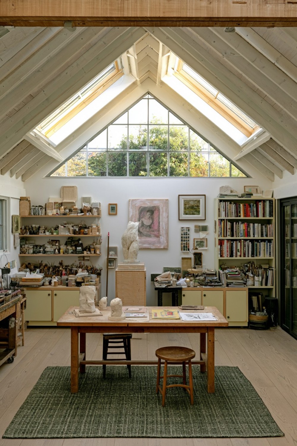 Attic sculpting studio with freestanding movable work pedestals