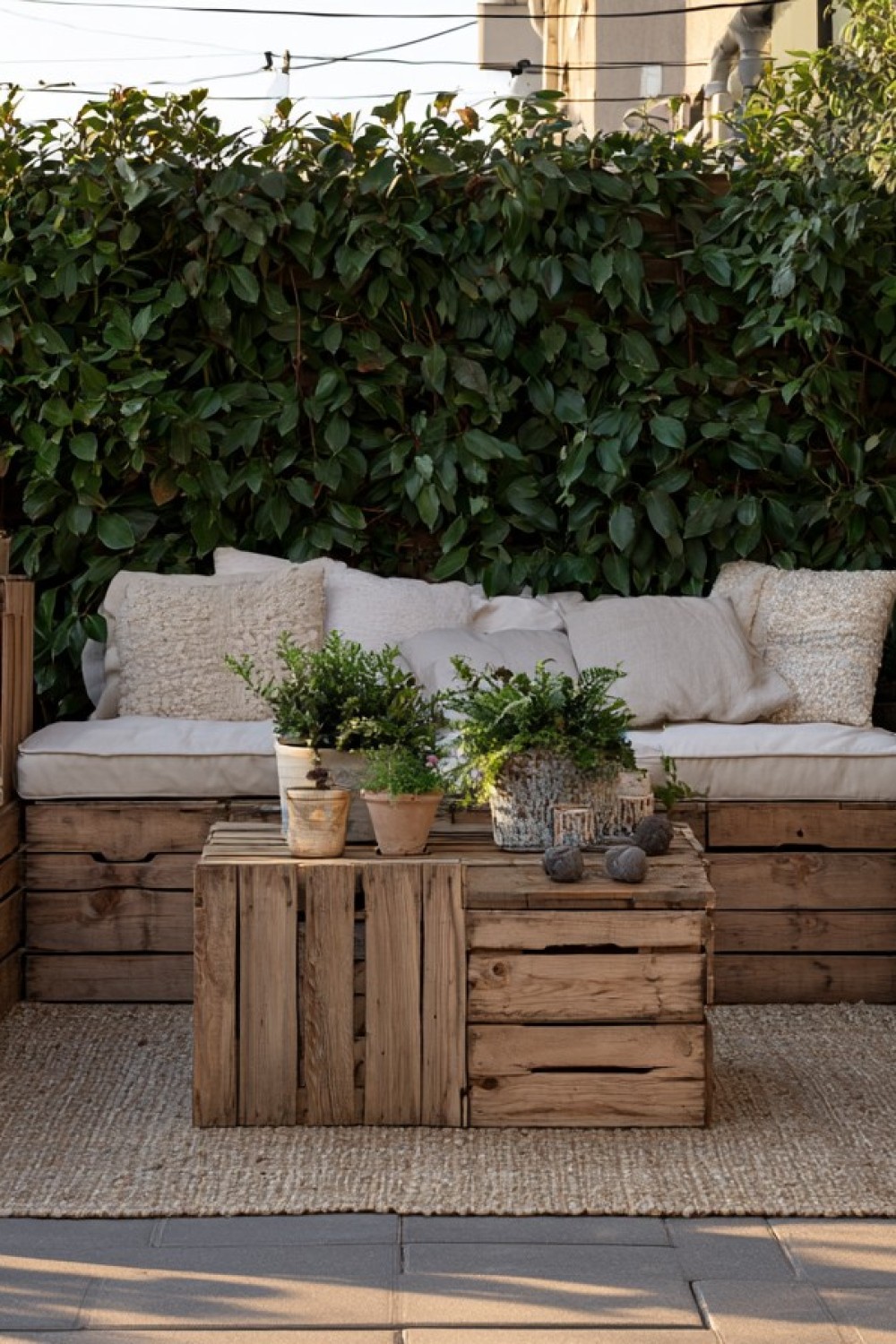 Wooden crates arranged as modular patio storage