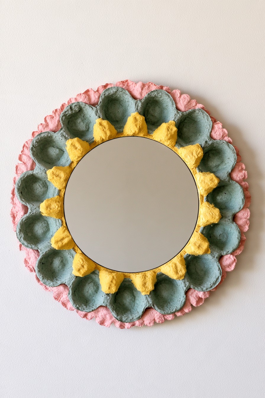 Layered sunburst mirror decorated with painted egg carton petals