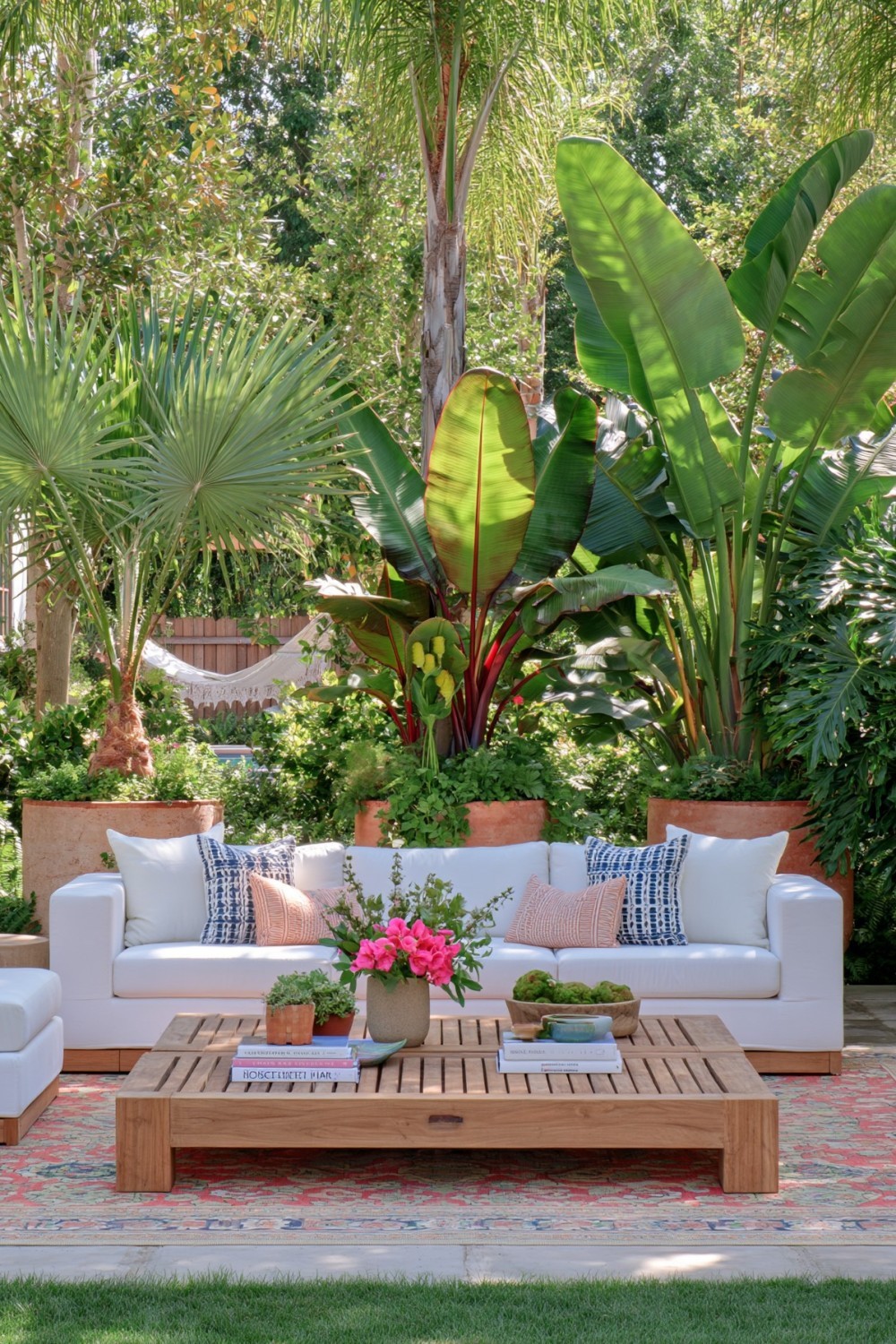 Large planters forming a lush green background on a tropical patio
