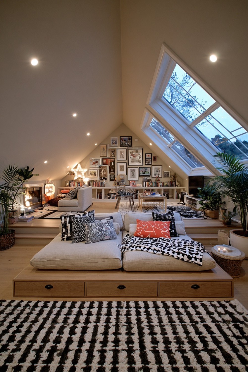 Attic entertainment room with carefully planned platform seating