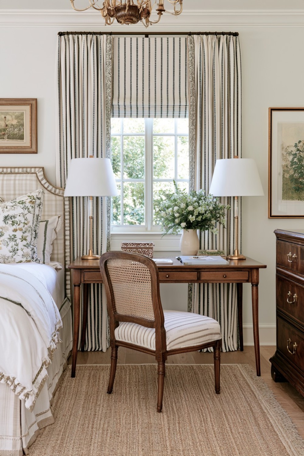 Traditional writing desk paired with a cane chair in a bedroom