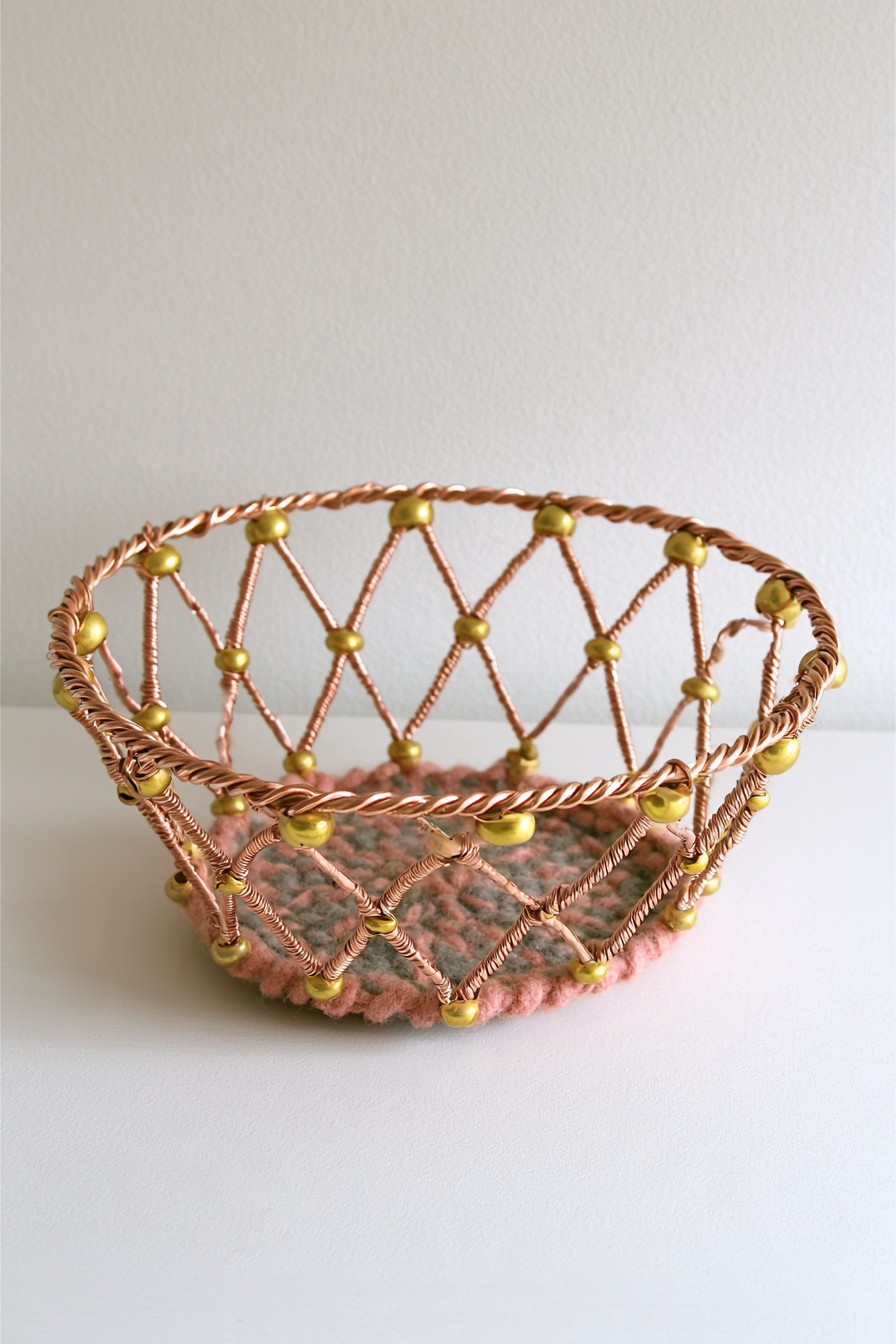 Copper wire catchall basket with beaded lattice and textile base