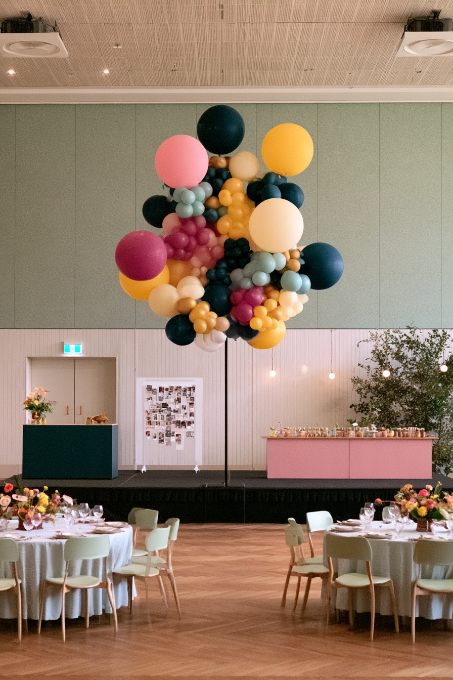 Graduation party with overhead balloon installation