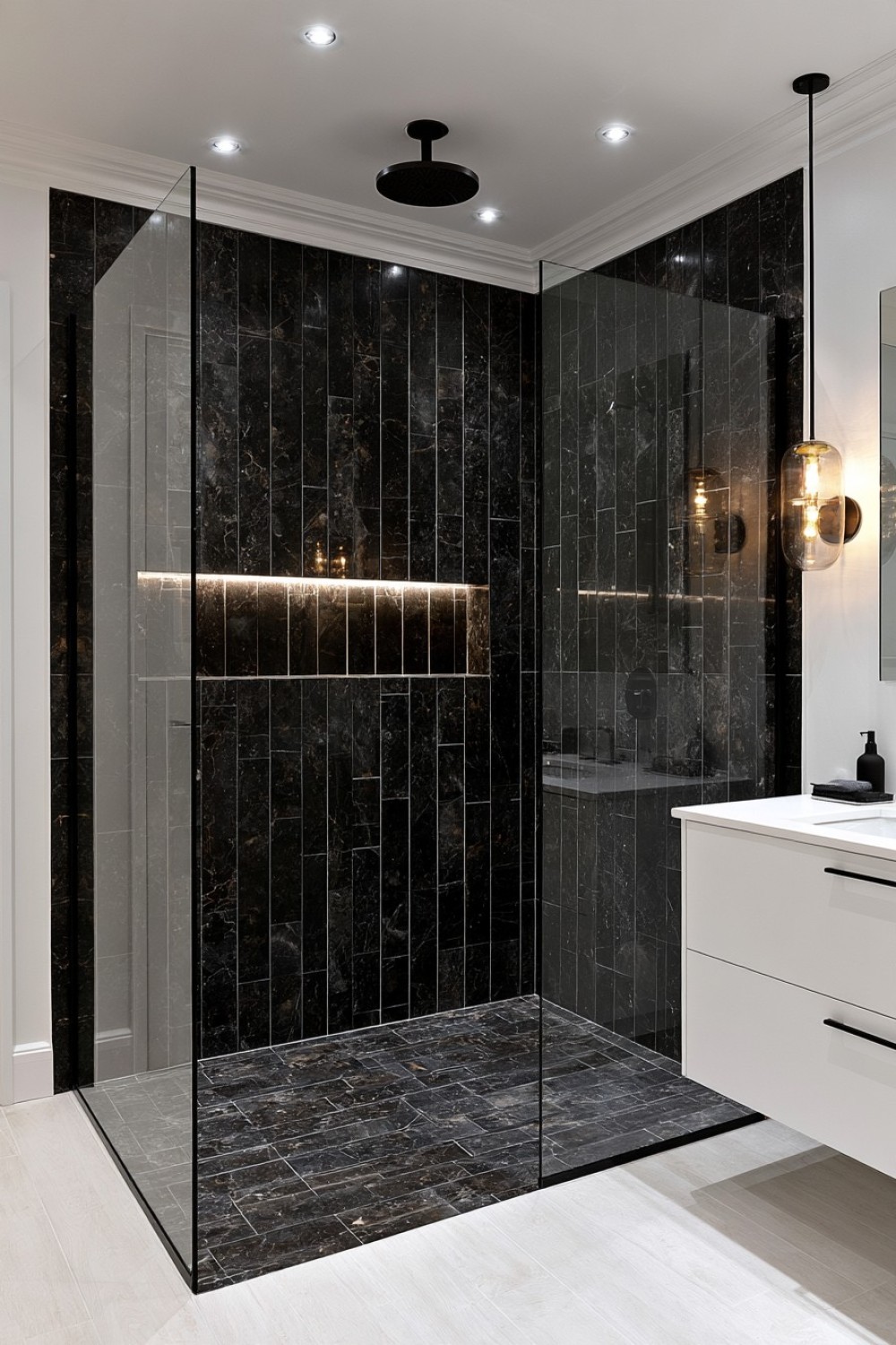 Dark black shower enclosure surrounded by bright white bathroom surfaces