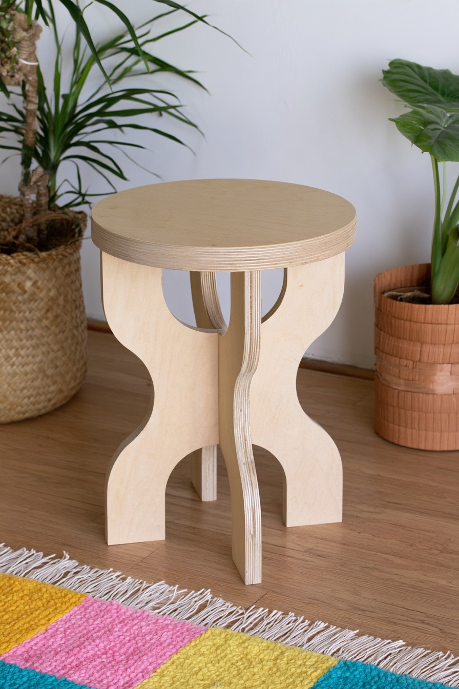 Sculptural plywood stool with curved interlocking legs