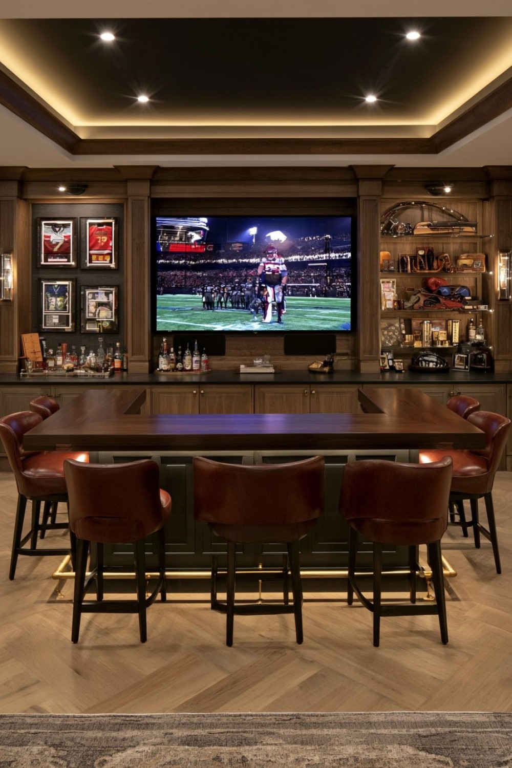 Refined basement sports bar with restrained memorabilia display