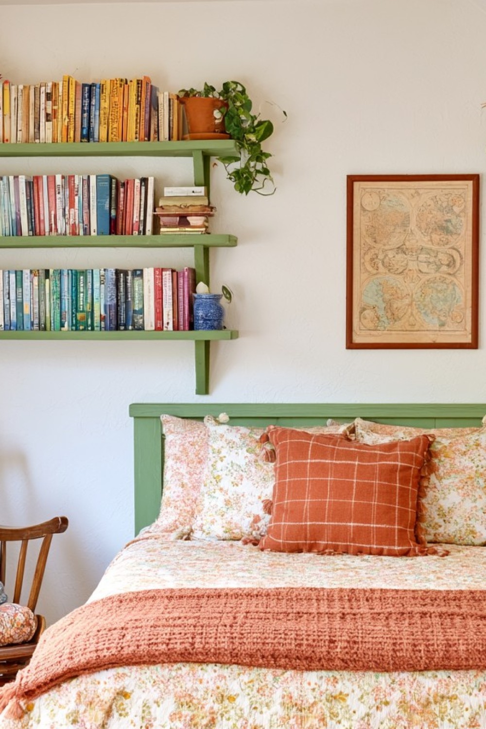 Vintage library attic bedroom with bookshelves fitted beneath the eaves