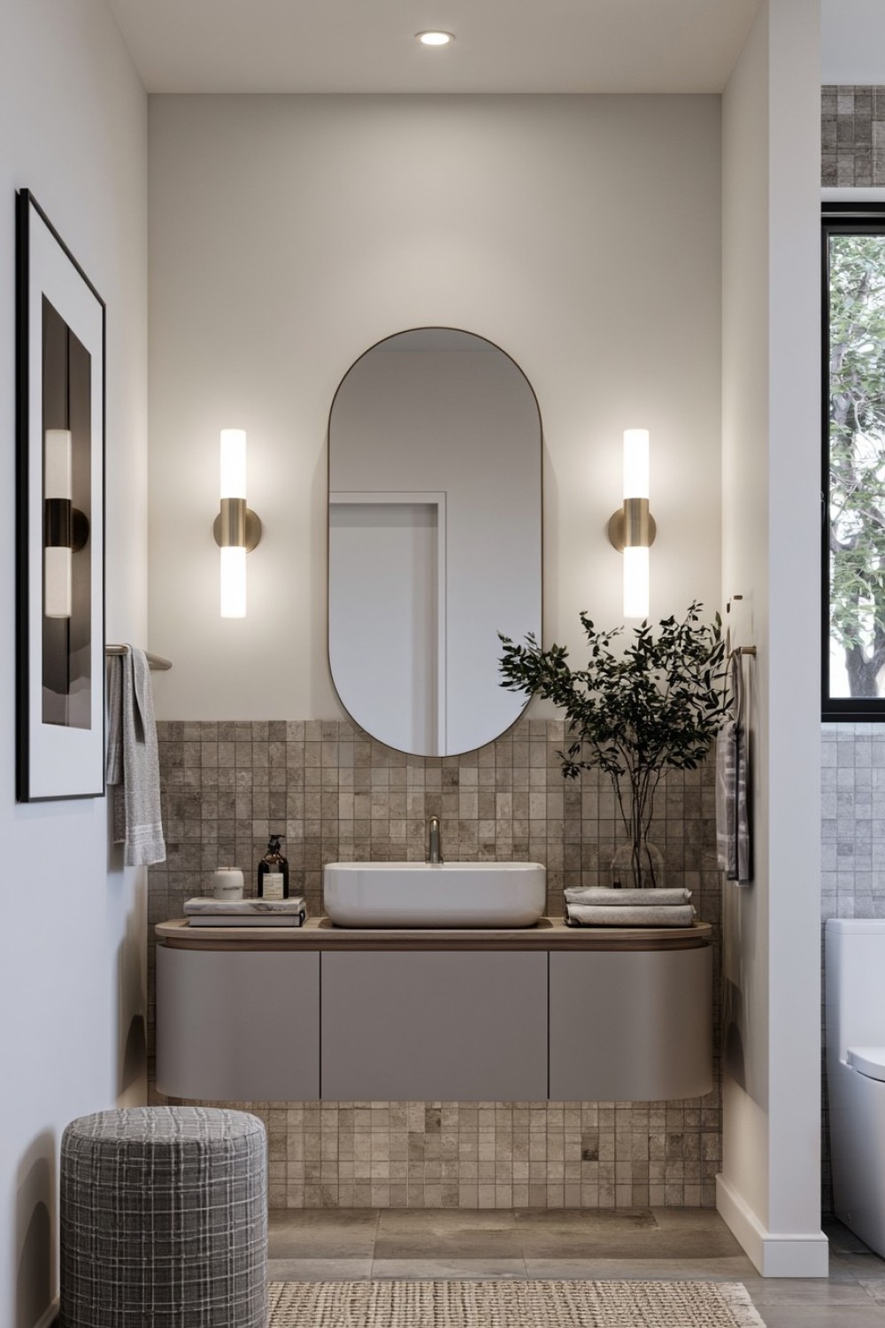 Small bathroom remodeled around a rounded corner vanity