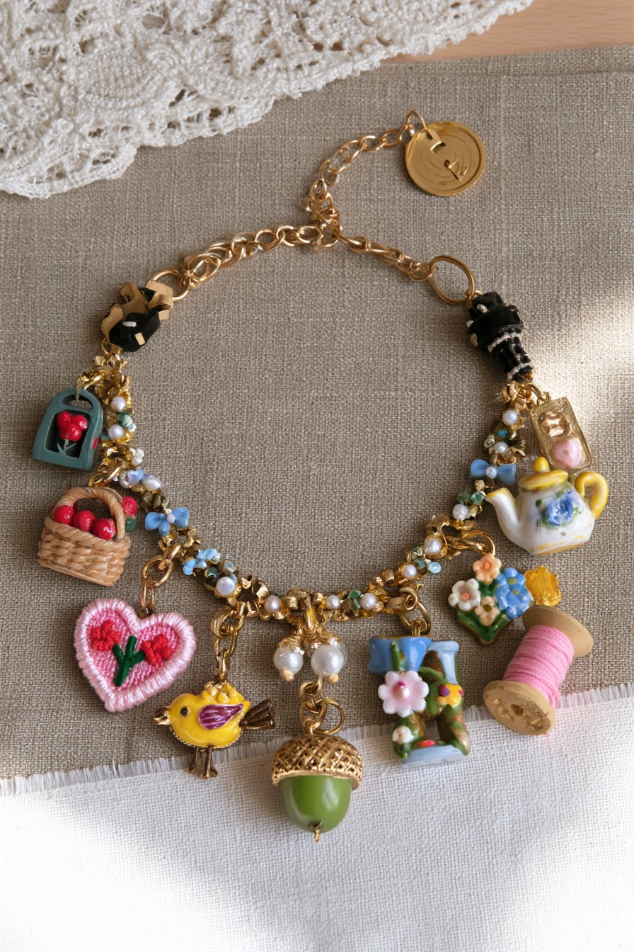 Cottagecore charm bracelet with teapot spool embroidered heart basket bird and acorn
