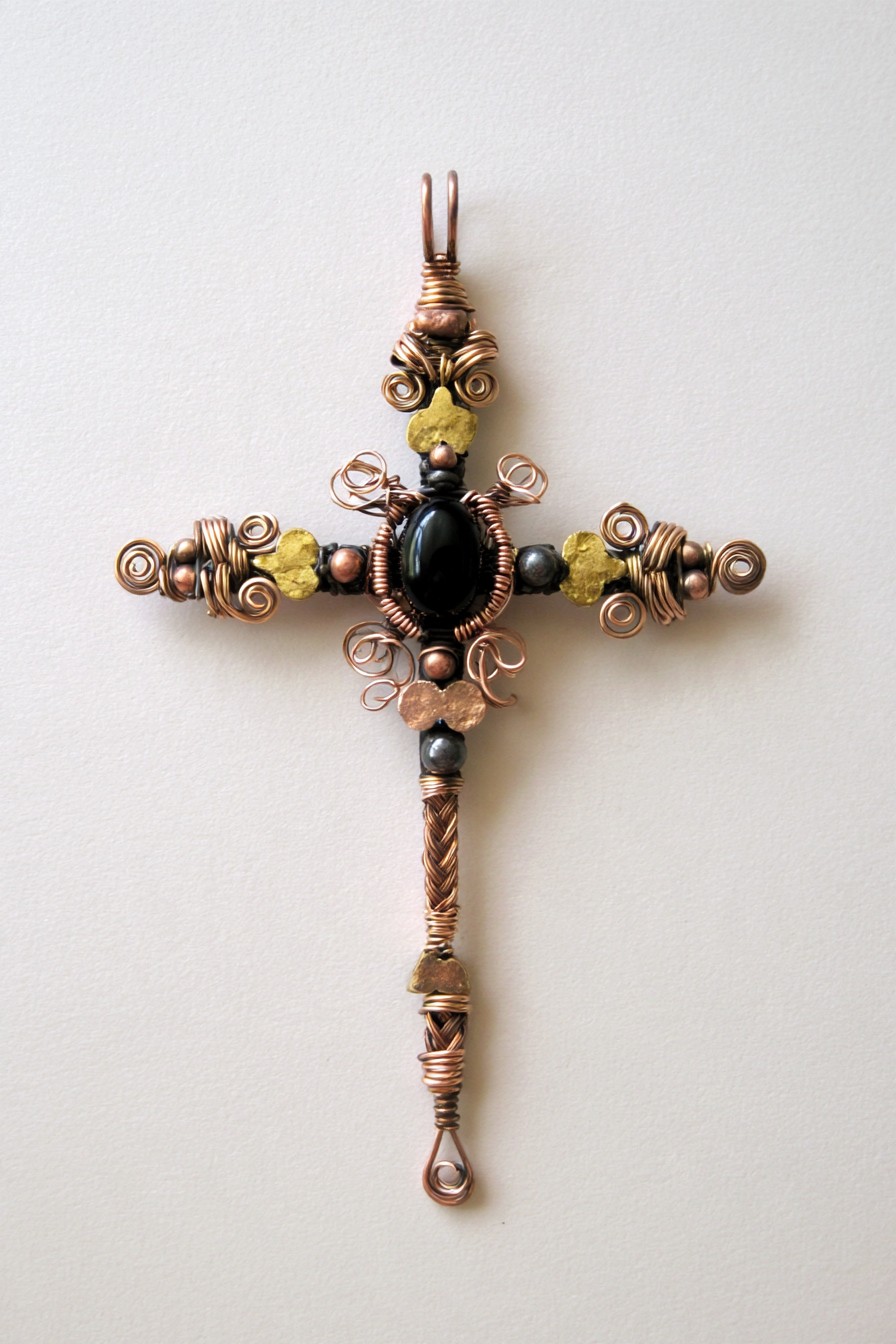 Antique copper cross with a black stone focal point