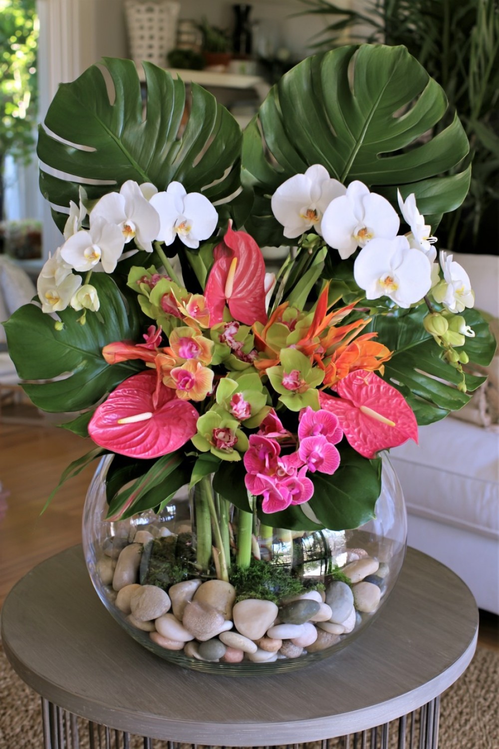 12. Transparent Tropical Terrarium Centerpiece