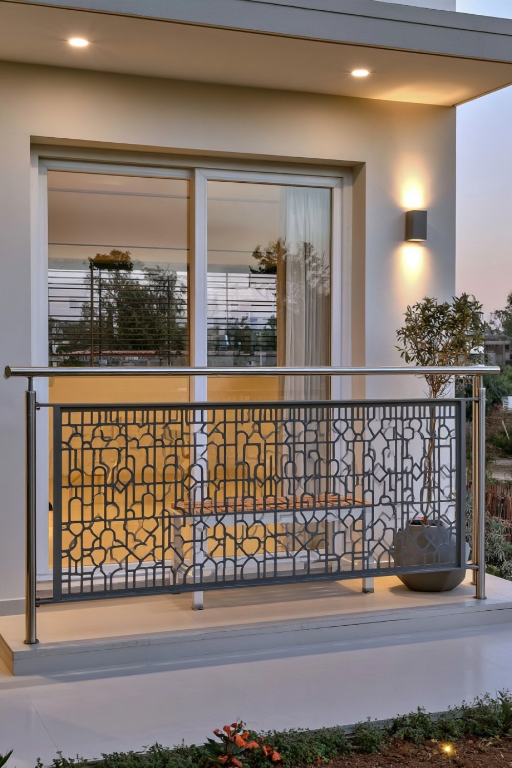 Geometric laser-cut metal panels used as balcony railing screens
