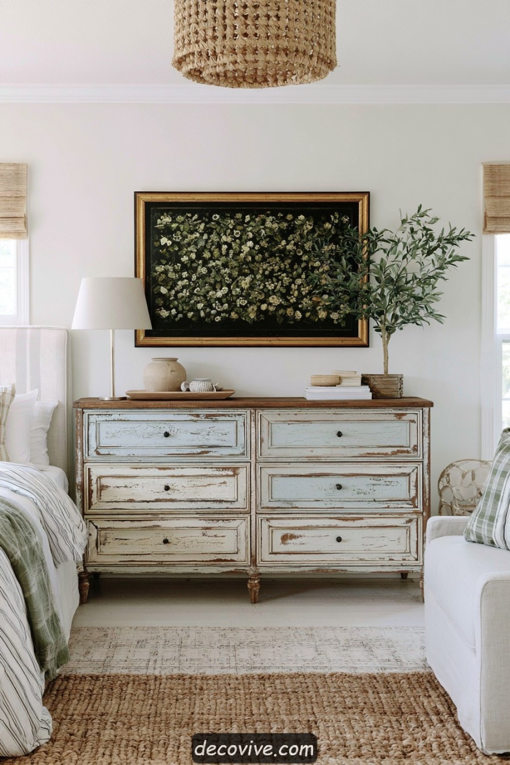 Weathered vintage dresser forming a farmhouse bedroom focal point