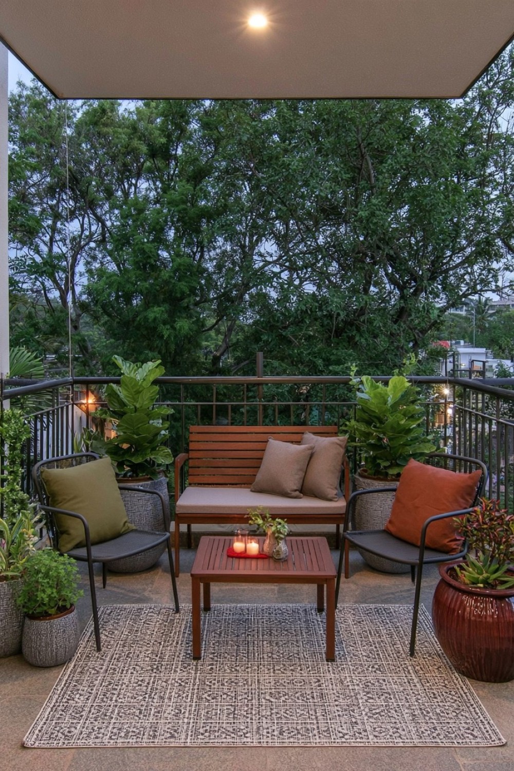 Moody balcony decorated with deep green tones and dark wood