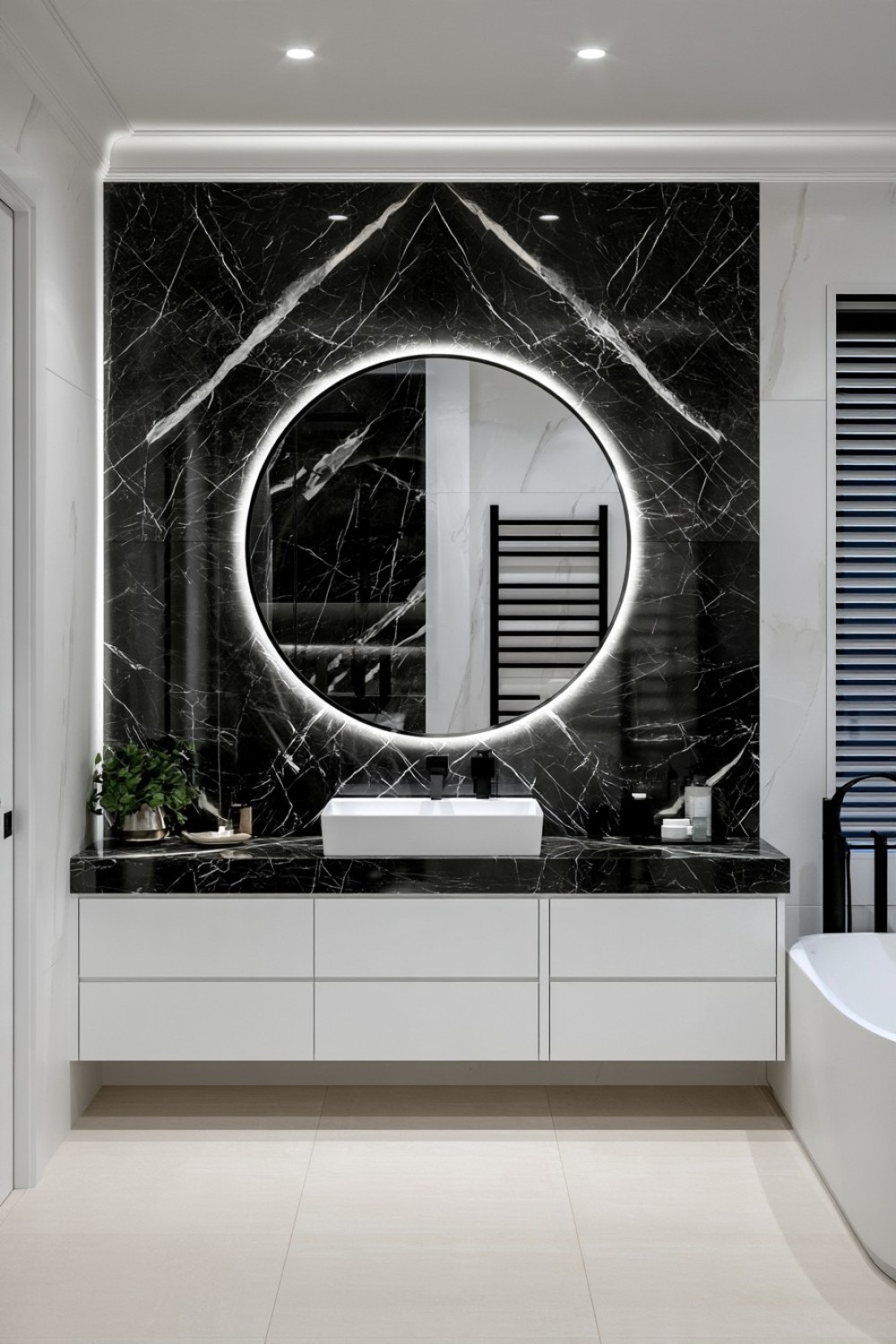 Black marble bathroom surface with expressive white veining