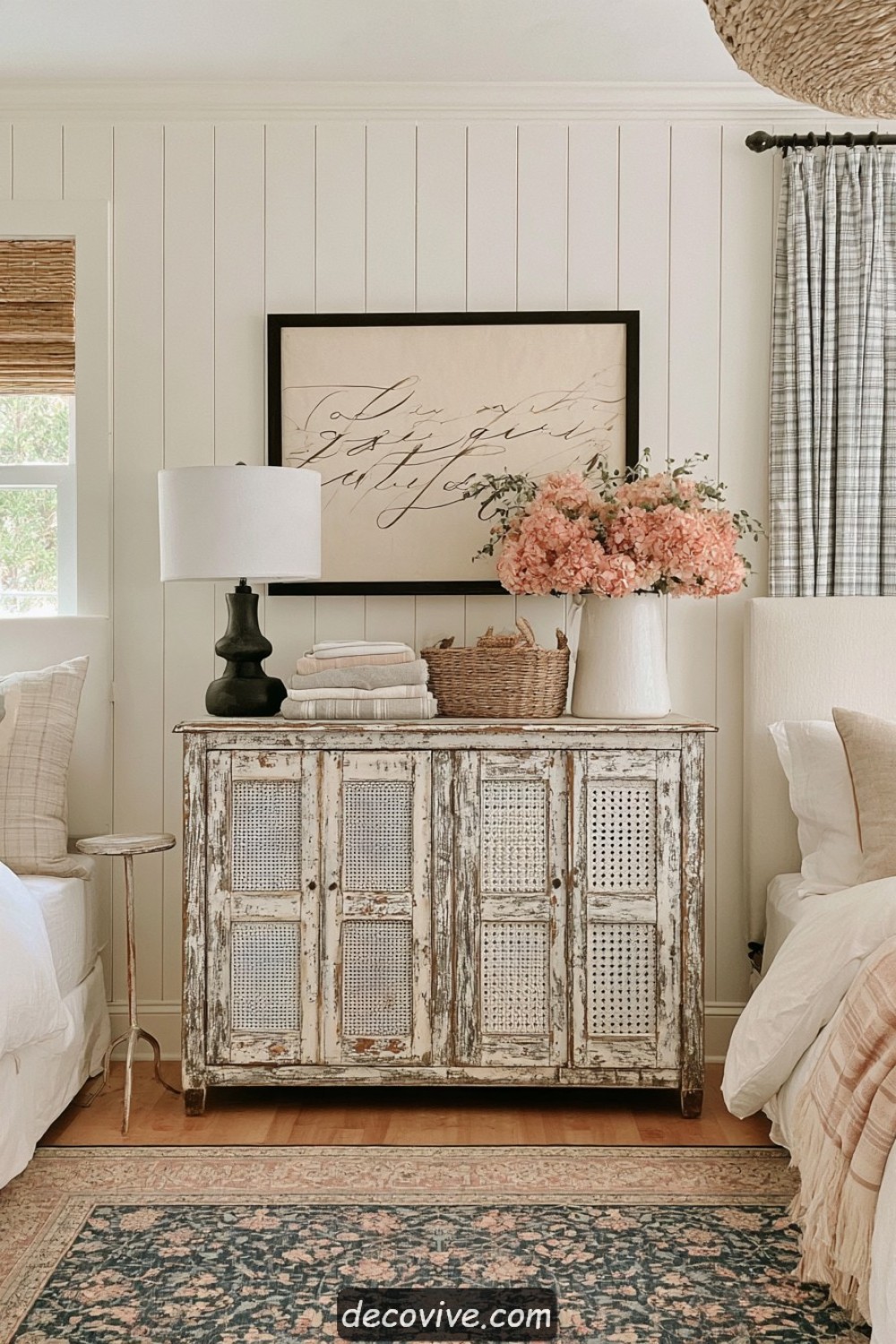 Vintage pie safe repurposed as farmhouse bedroom linen storage