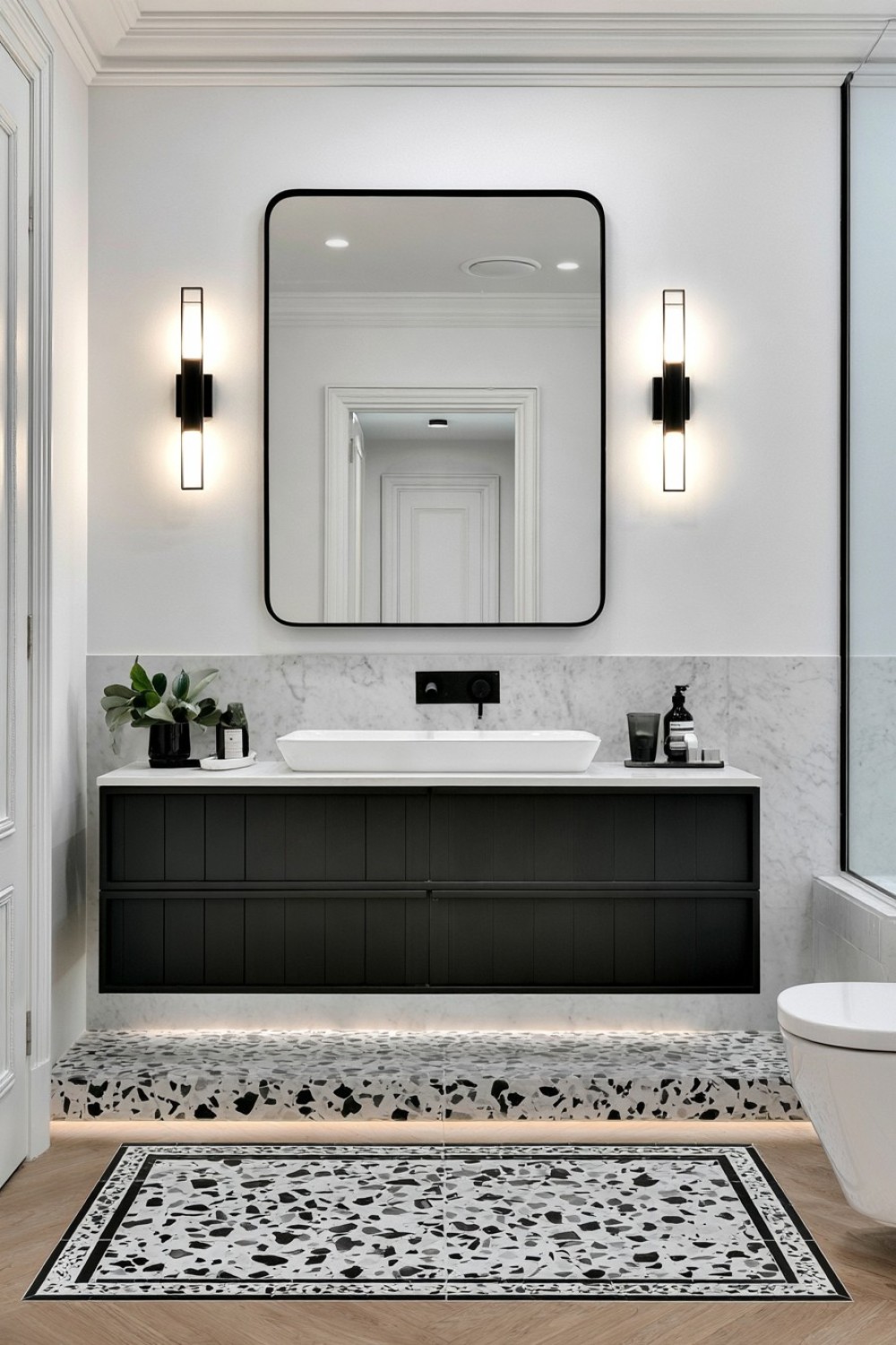 Black and white terrazzo used as the main bathroom surface