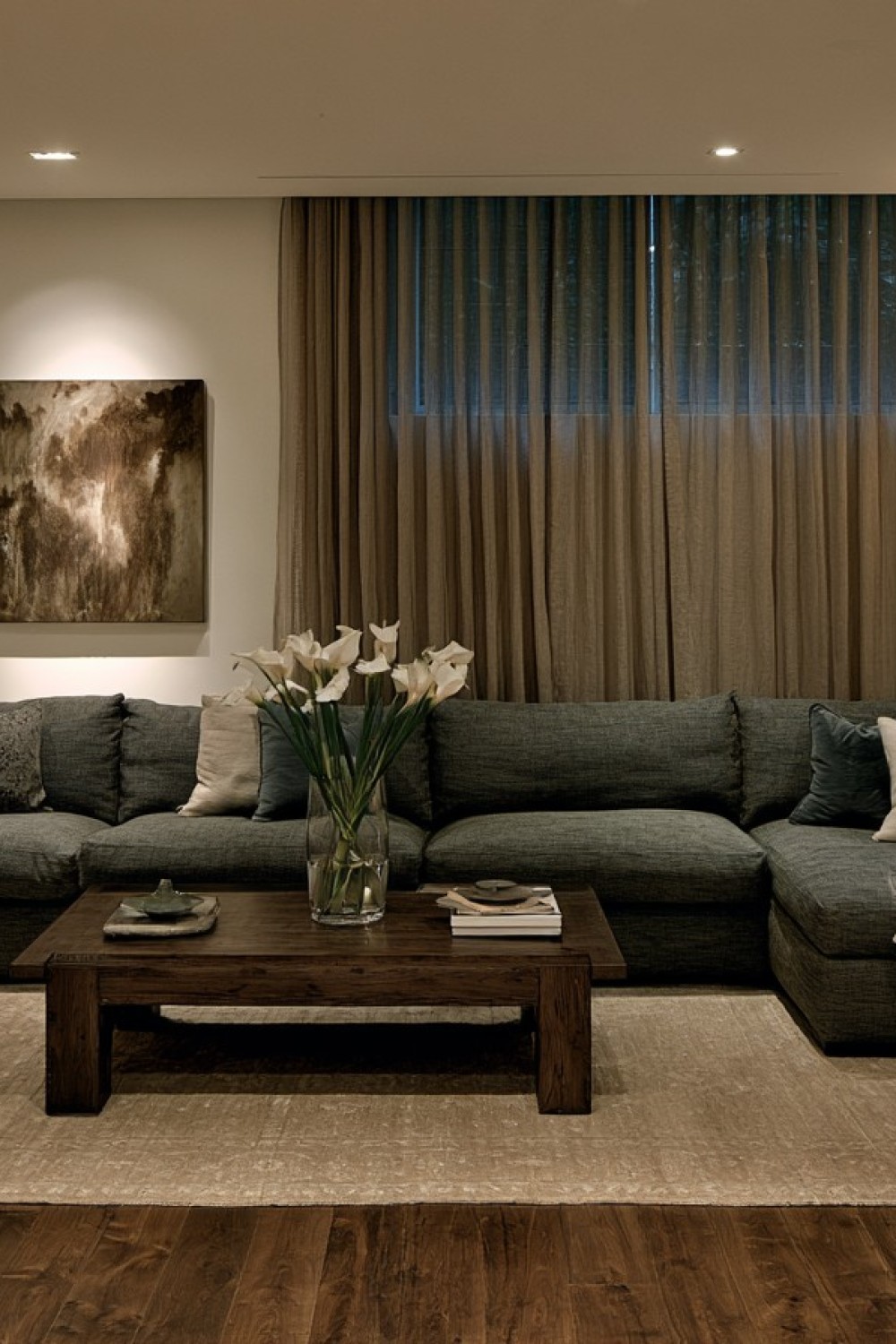 Full-length curtains improving the proportions of a low basement