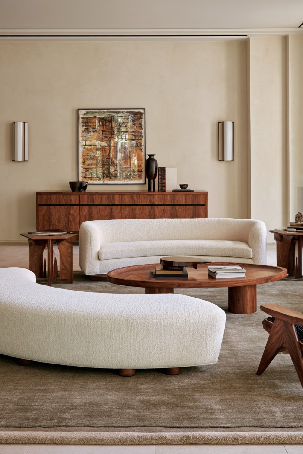 Curved sofa balanced with angular walnut living room furniture