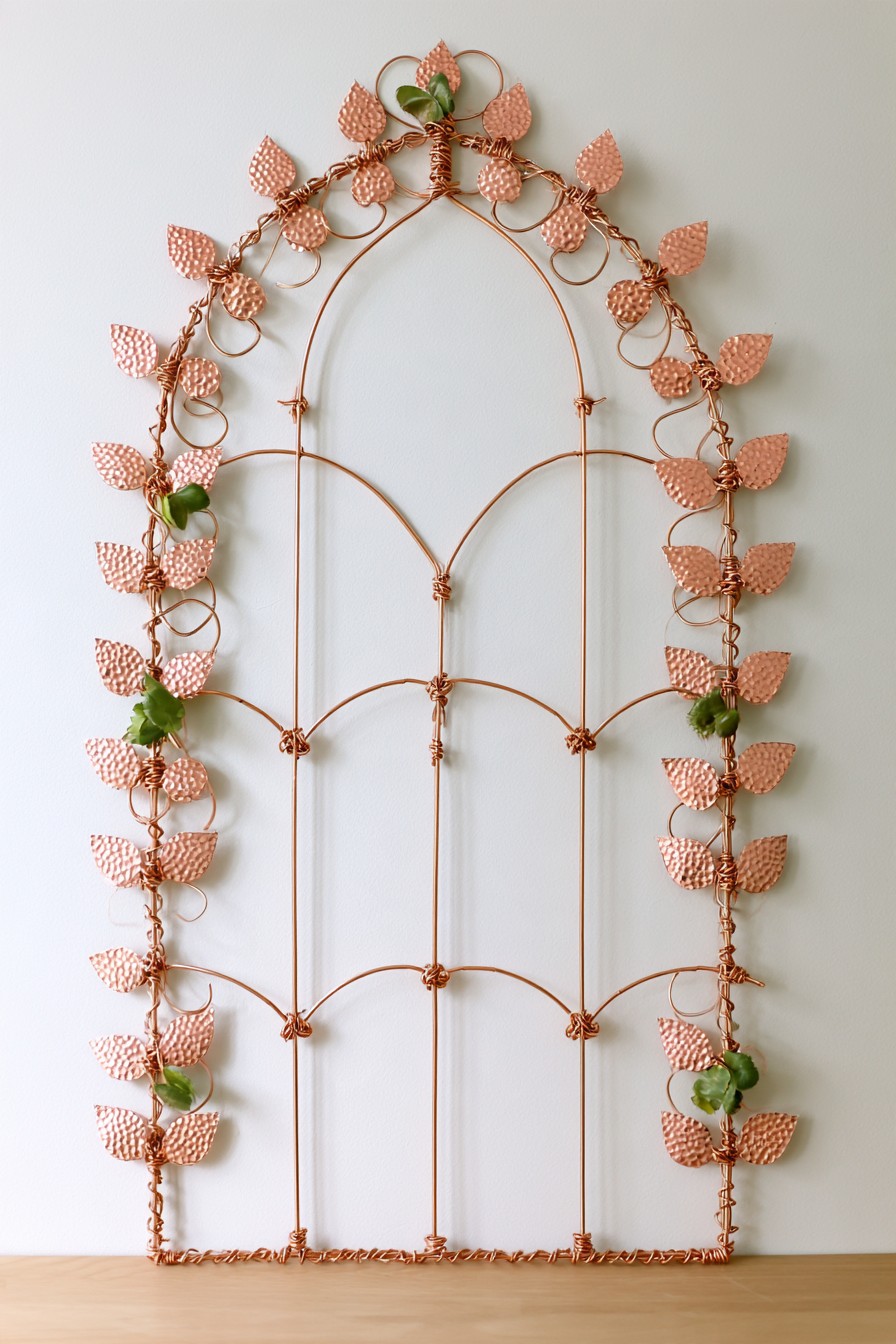 Botanical copper wire arch wall decoration with hammered metal leaves