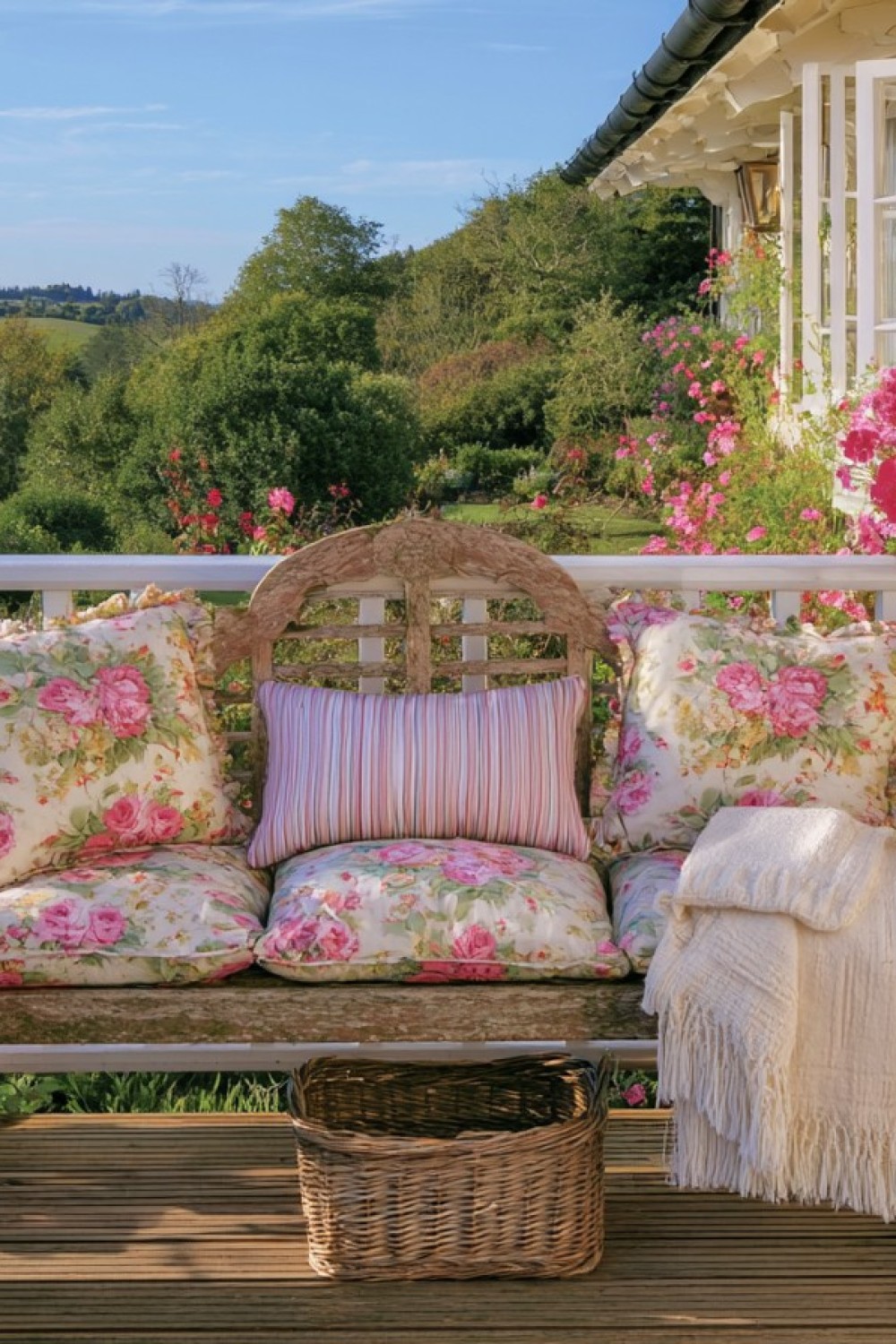 Weather-resistant floral cushions softening cottage balcony seating