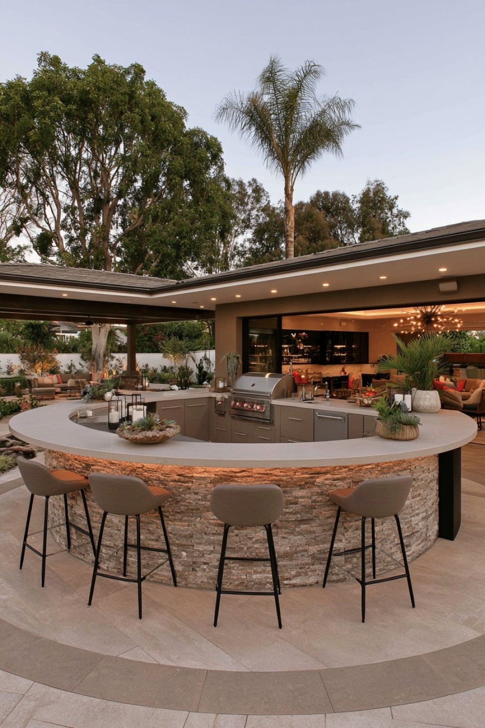 Curved outdoor kitchen following the shape of a circular patio