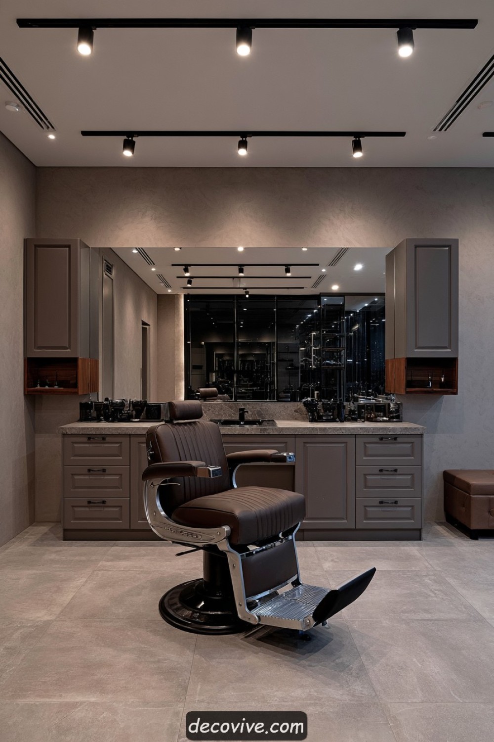 Monochromatic taupe barber studio with layered commercial finishes