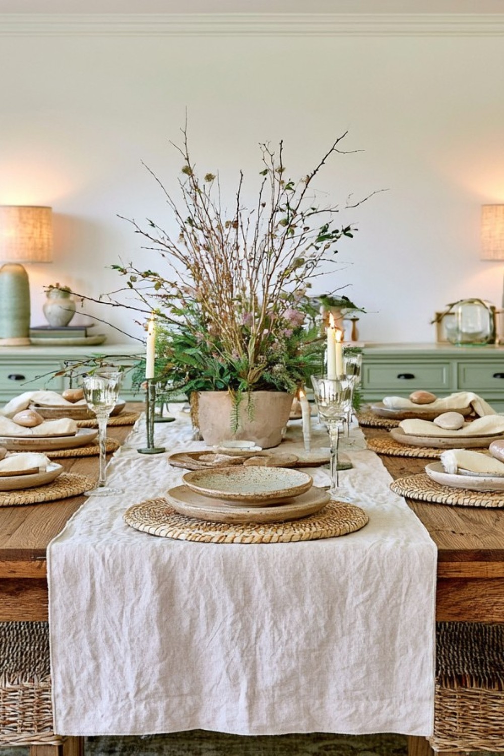 Table setting layered with linen wood and natural woven materials